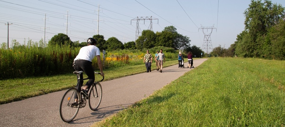 pedestrians and cyclists share a portion of The Meadoway multi-use trail
