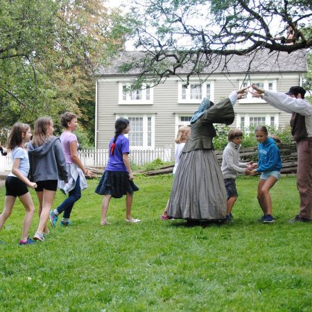 children learn traditional dance from history actors at Black Creek Village
