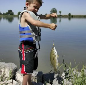 A boy with a fish