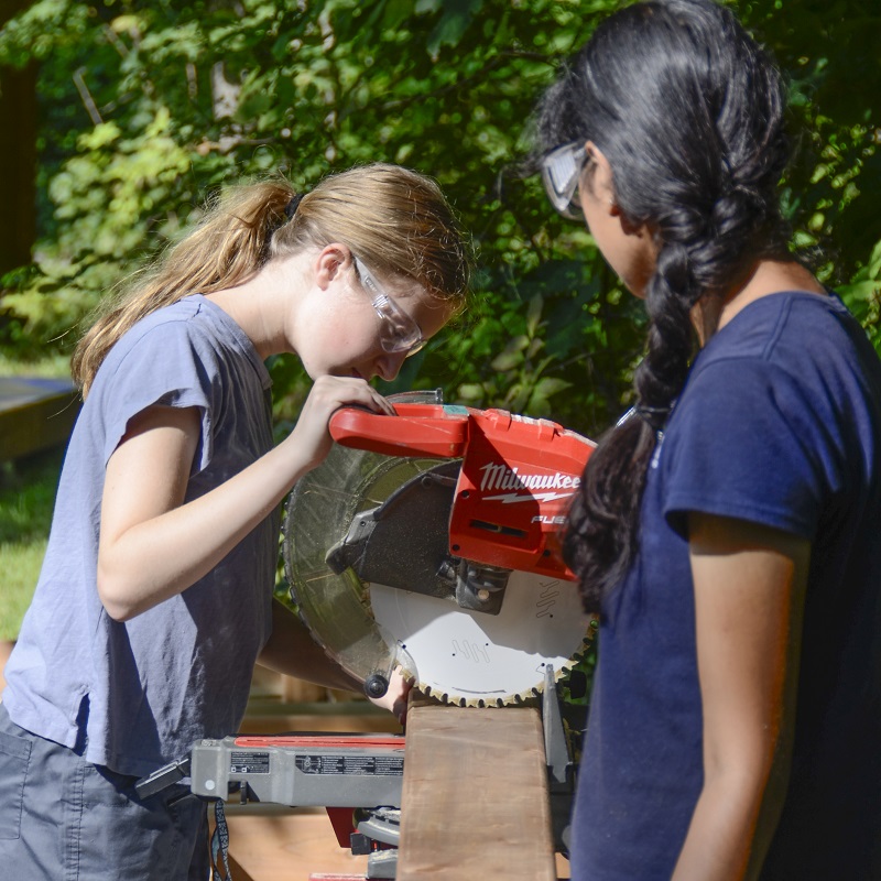 Girls Can Too program participants take part in a building project