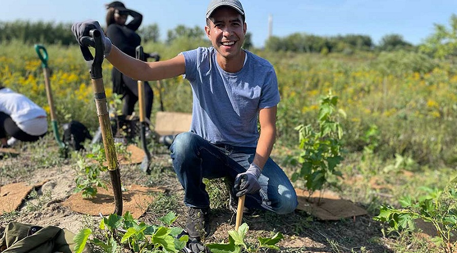 community member takes part in a TRCA tree planting event